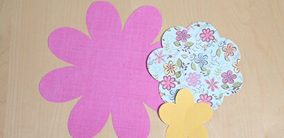 Stack 2-3 sizes/shapes and put a brad through the middle to hold the flower together.
