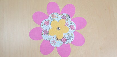 If desired, create single layer flowers by putting brad through single flower shape.
