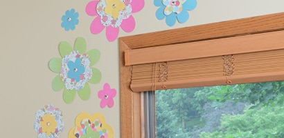 Arrange flowers around a window and hang with Command™ Poster Strips.

